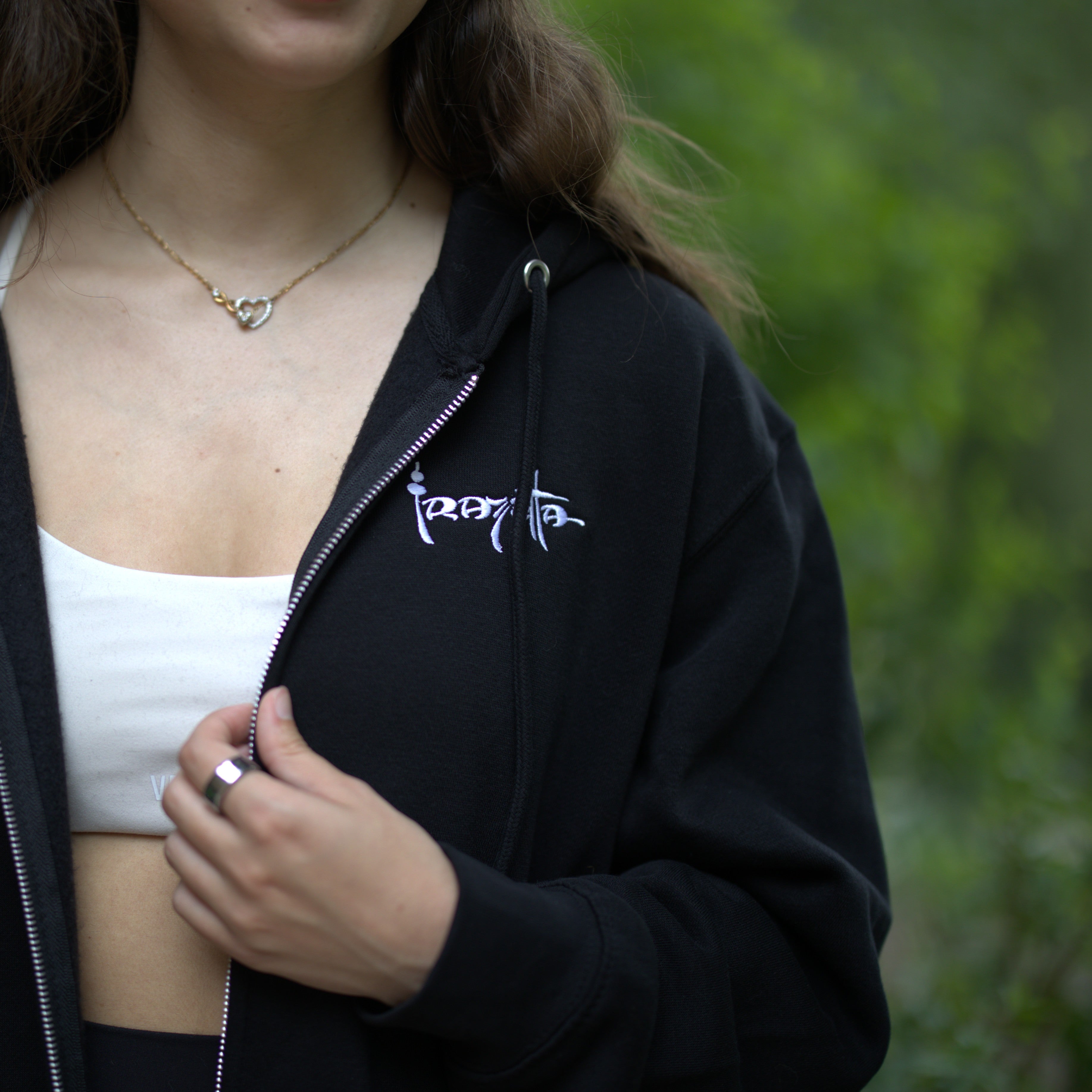 Photo of a woman wearing The Death Dealer I Zip-Up Hoodie – Featuring a Frazetta&