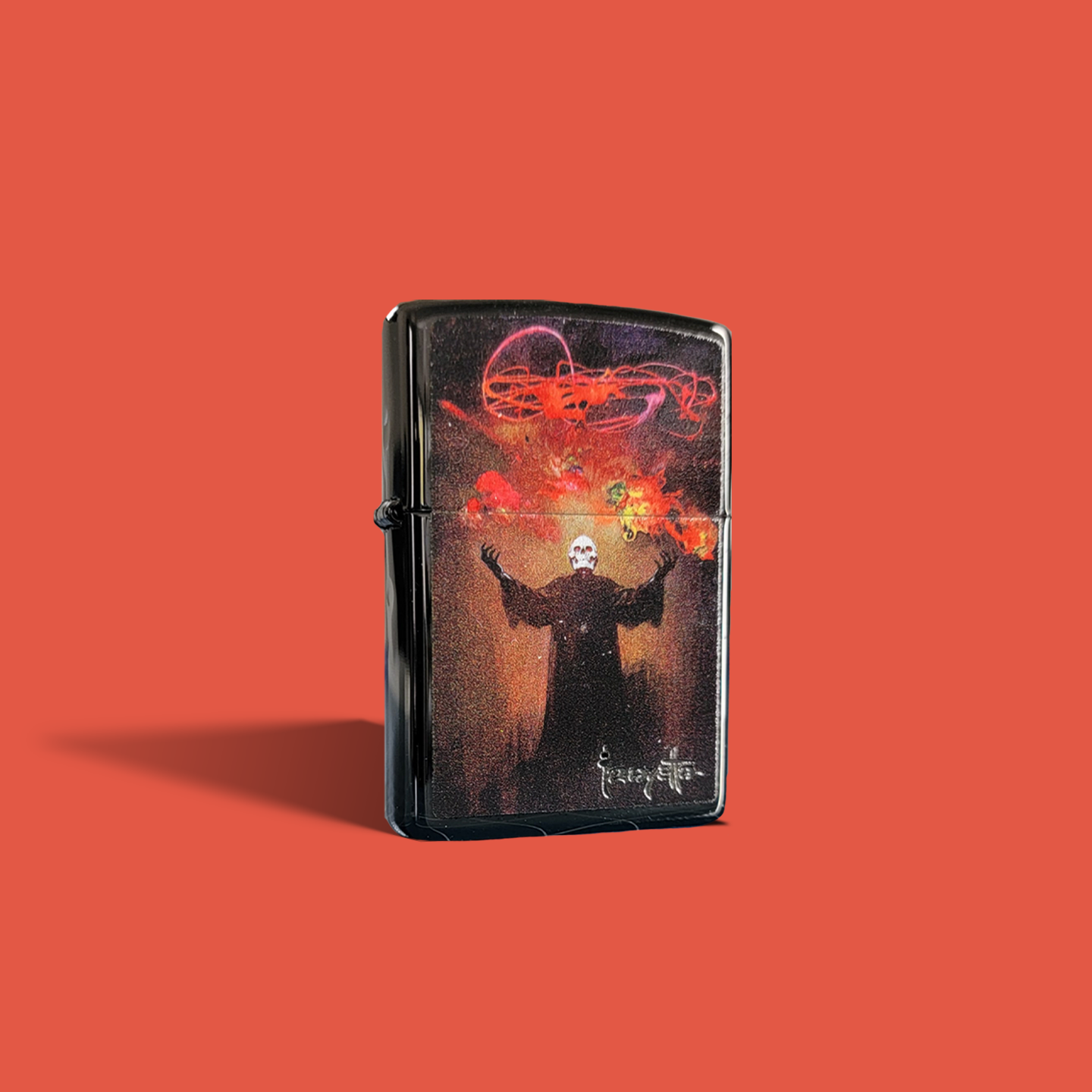Zippo lighter with Frazetta’s “Devil’s Generation” art, an eerie figure with a skull face conjures colorful energy in a fiery, abstract inferno.