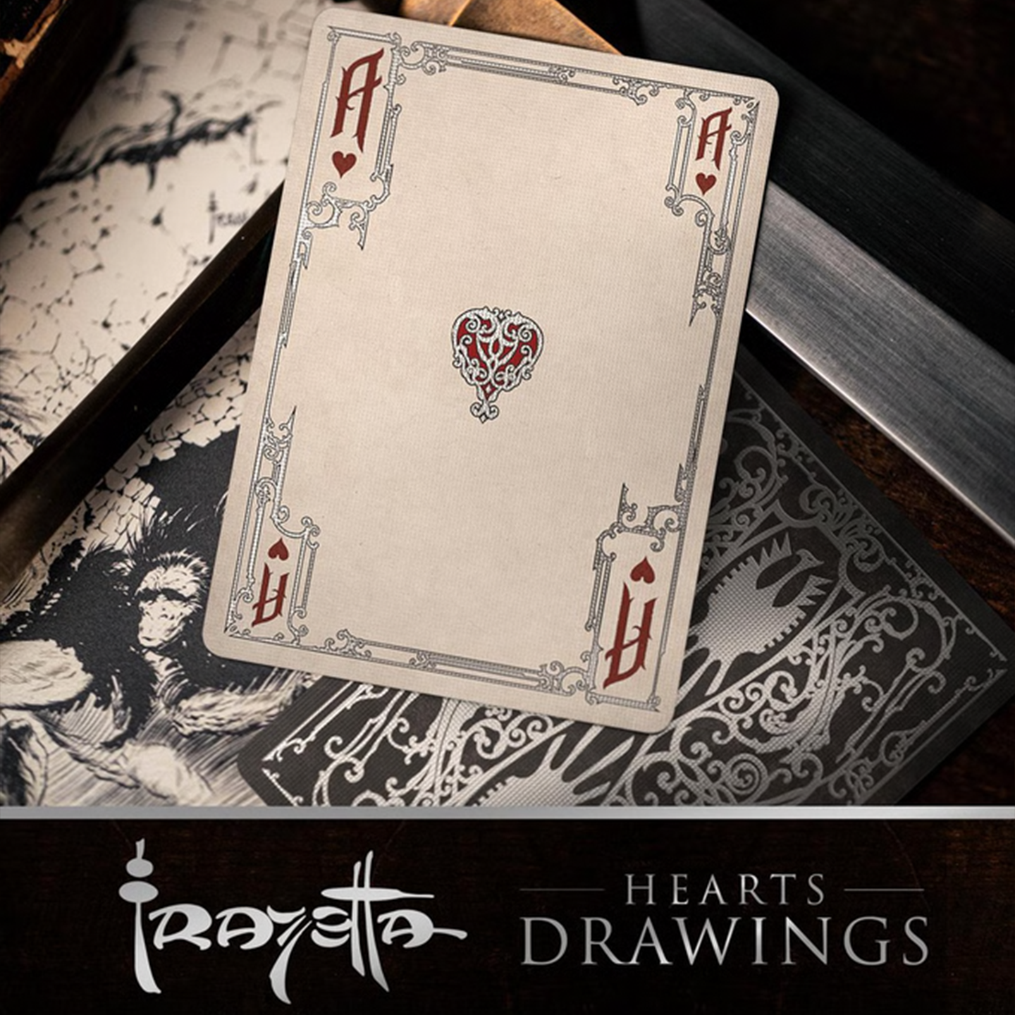 A close-up of an Ace of Hearts from the Frazetta Drawings Edition playing card deck. The card features an ornate, vintage-style border with delicate filigree and a stylized club symbol at its center. Beneath it, additional cards are partially visible, showcasing intricate artwork and embossed detailing. A knife rests nearby, enhancing the dramatic composition.