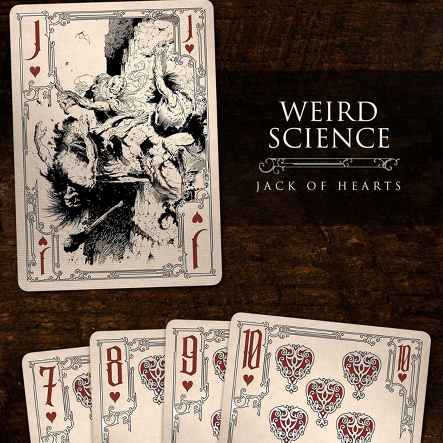 A close-up of a Jack of Hearts from the Frazetta Drawings Edition playing card deck. The card features an iconic Frazetta drawing with an ornate, vintage-style border with delicate filigree. Beneath it, additional cards are partially visible, showcasing intricate artwork and embossed detailing.