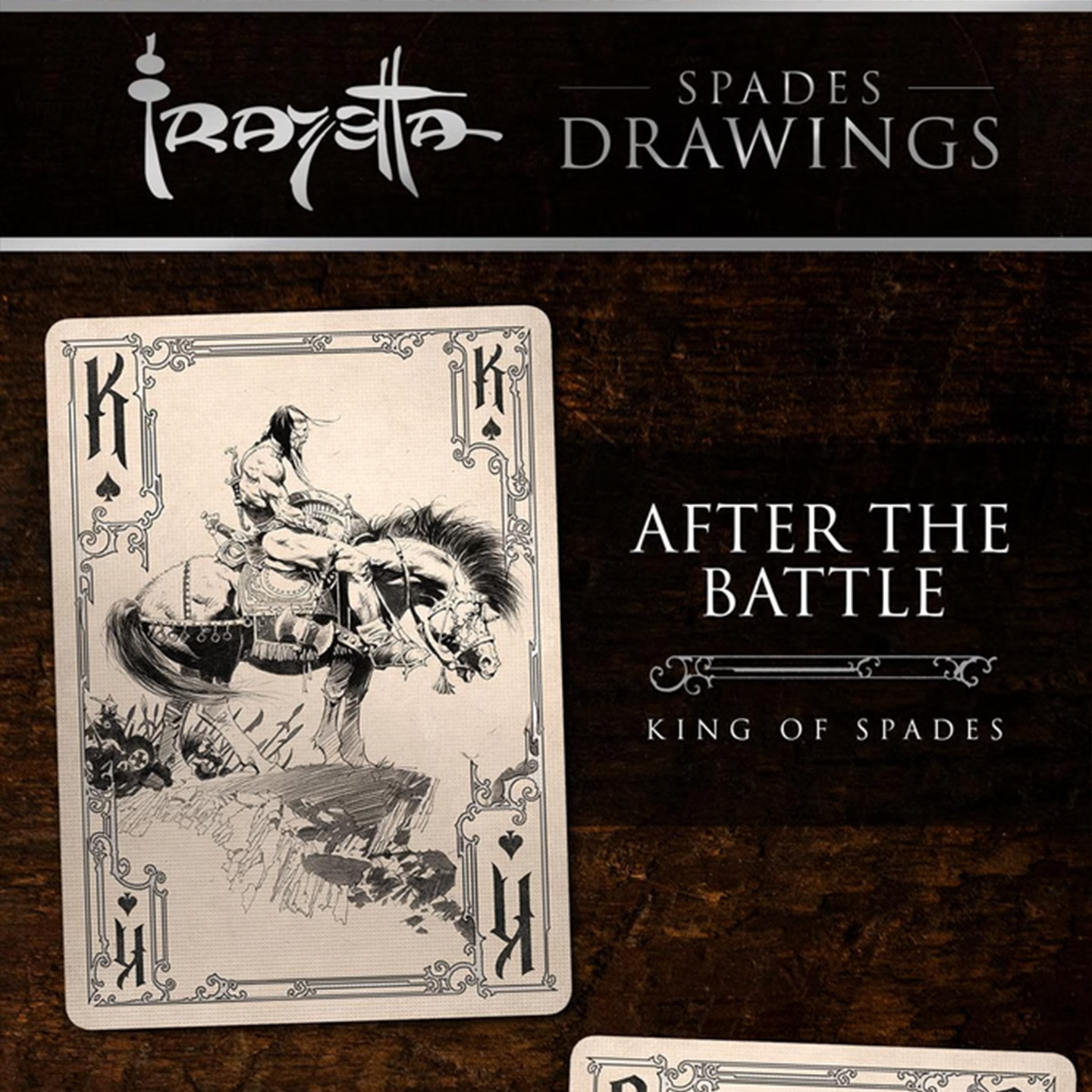 A close-up of a King of Spades from the Frazetta Drawings Edition playing card deck. The card features an iconic Frazetta drawing with an ornate, vintage-style border with delicate filigree. Beneath it, additional cards are partially visible, showcasing intricate artwork and embossed detailing.