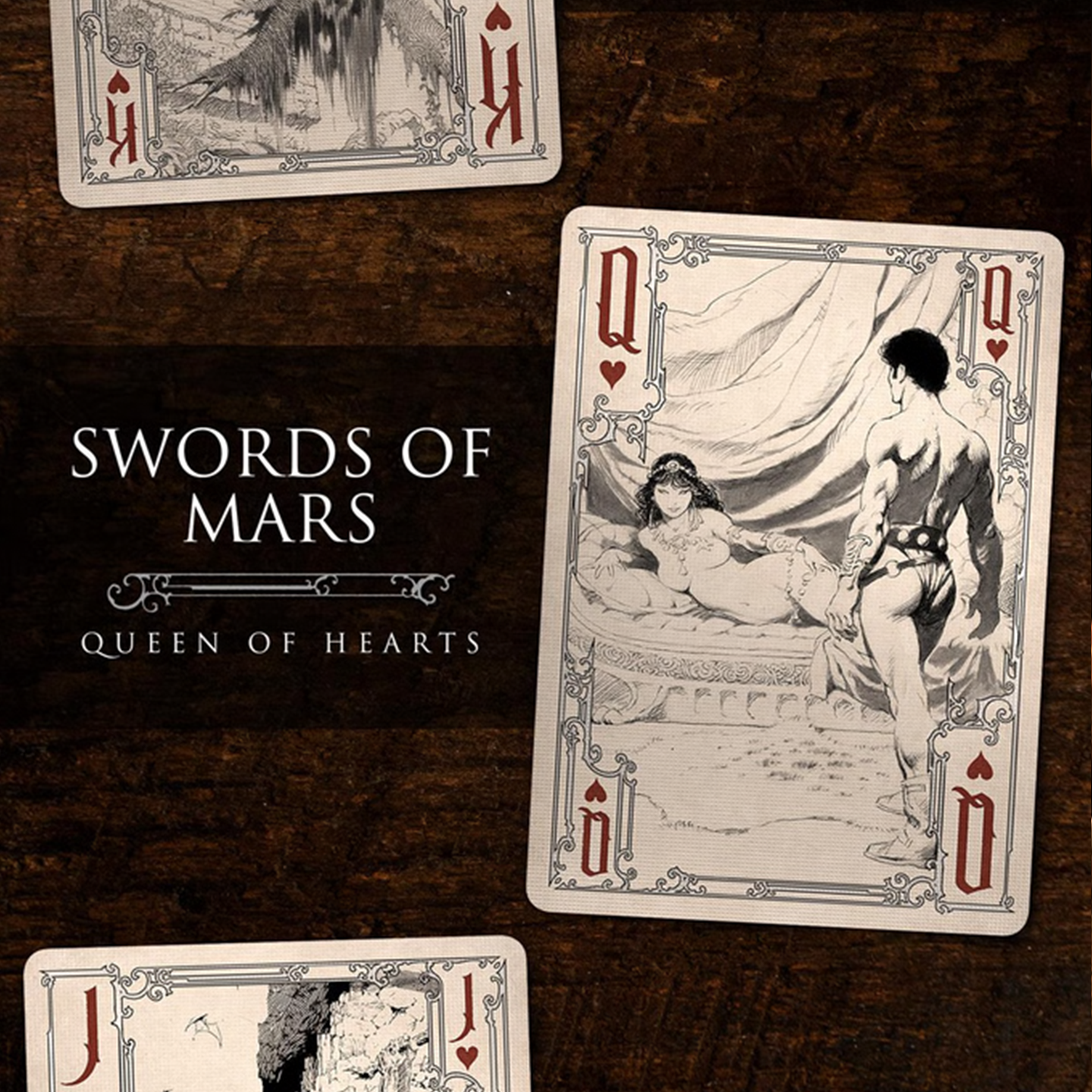 A close-up of a Queen of Hearts from the Frazetta Drawings Edition playing card deck. The card features an iconic Frazetta drawing with an ornate, vintage-style border with delicate filigree. Beneath it, additional cards are partially visible, showcasing intricate artwork and embossed detailing.