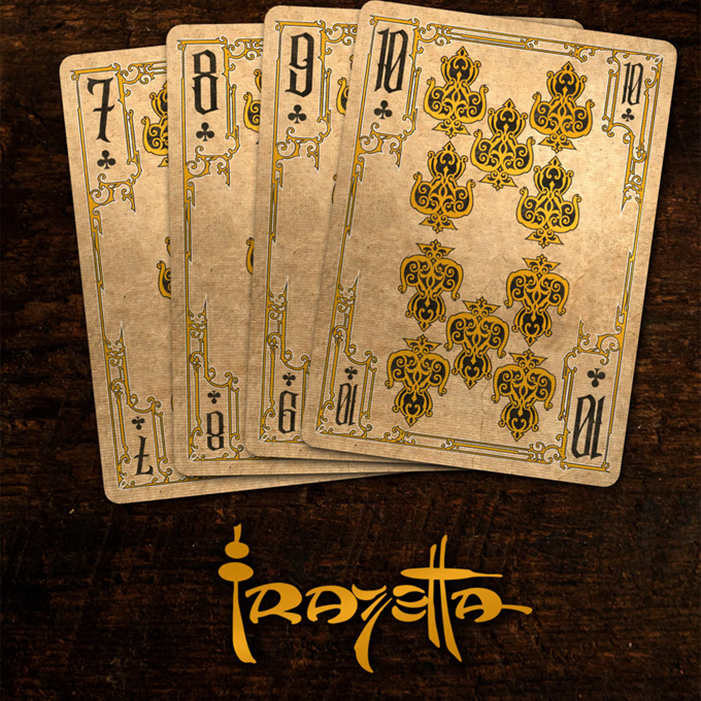 A close-up of cards seven through ten from the Frazetta Paintings Edition playing card deck. The cards feature an ornate, vintage-style border with delicate filigree and a stylized club symbol at its center. Beneath it, additional cards are partially visible, showcasing intricate artwork and embossed detailing.