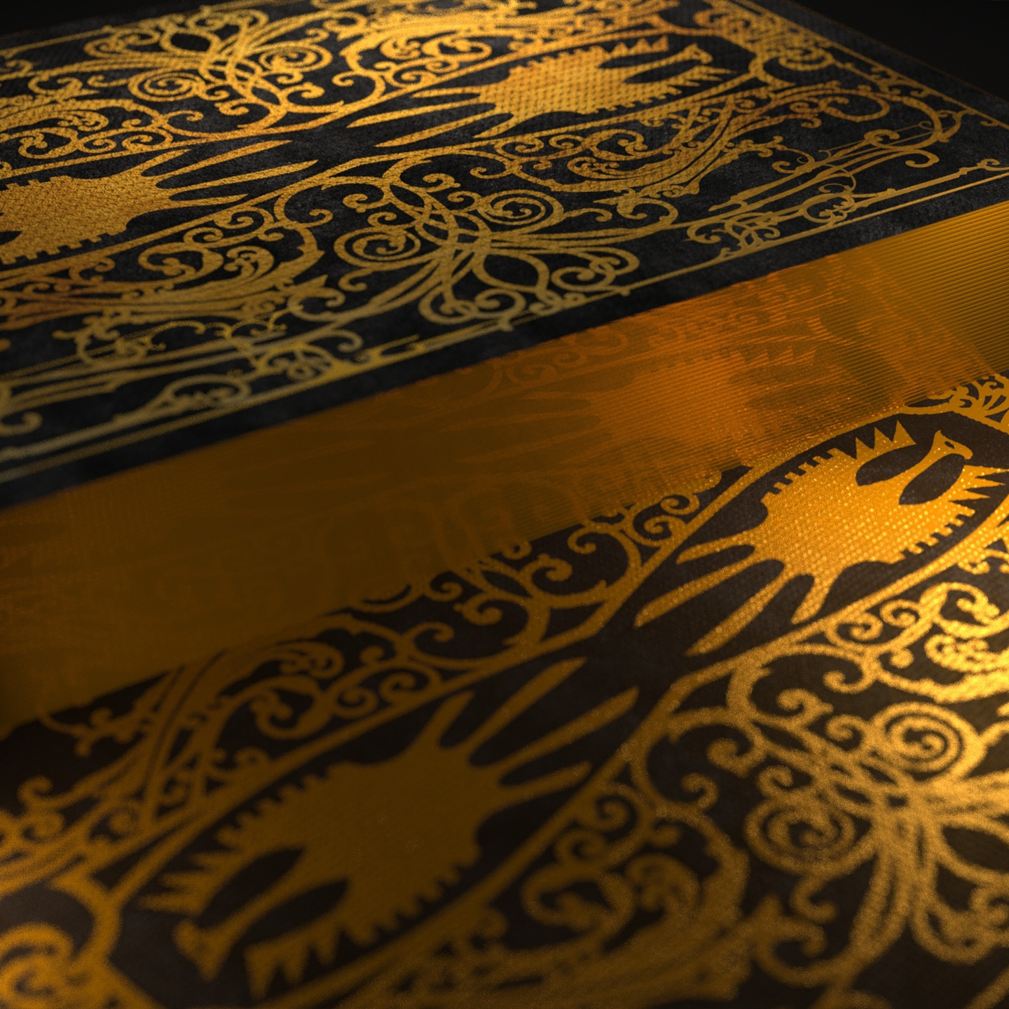 A close-up of a luxury playing card design featuring intricate gold foil detailing on a rich black background. The symmetrical pattern showcases an ornate shield emblem with a stylized eagle, surrounded by elaborate filigree. The reflective surface enhances the depth and texture, emphasizing the premium craftsmanship of the deck.