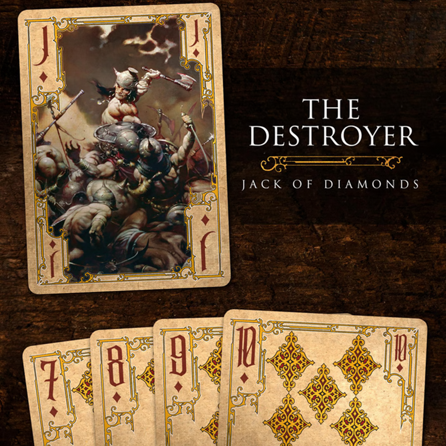 A close-up of a Jack of Diamonds from the Frazetta Paintings Edition playing card deck. The card features an iconic Frazetta drawing with an ornate, vintage-style border with delicate filigree. Beneath it, additional cards are partially visible, showcasing intricate artwork and embossed detailing.