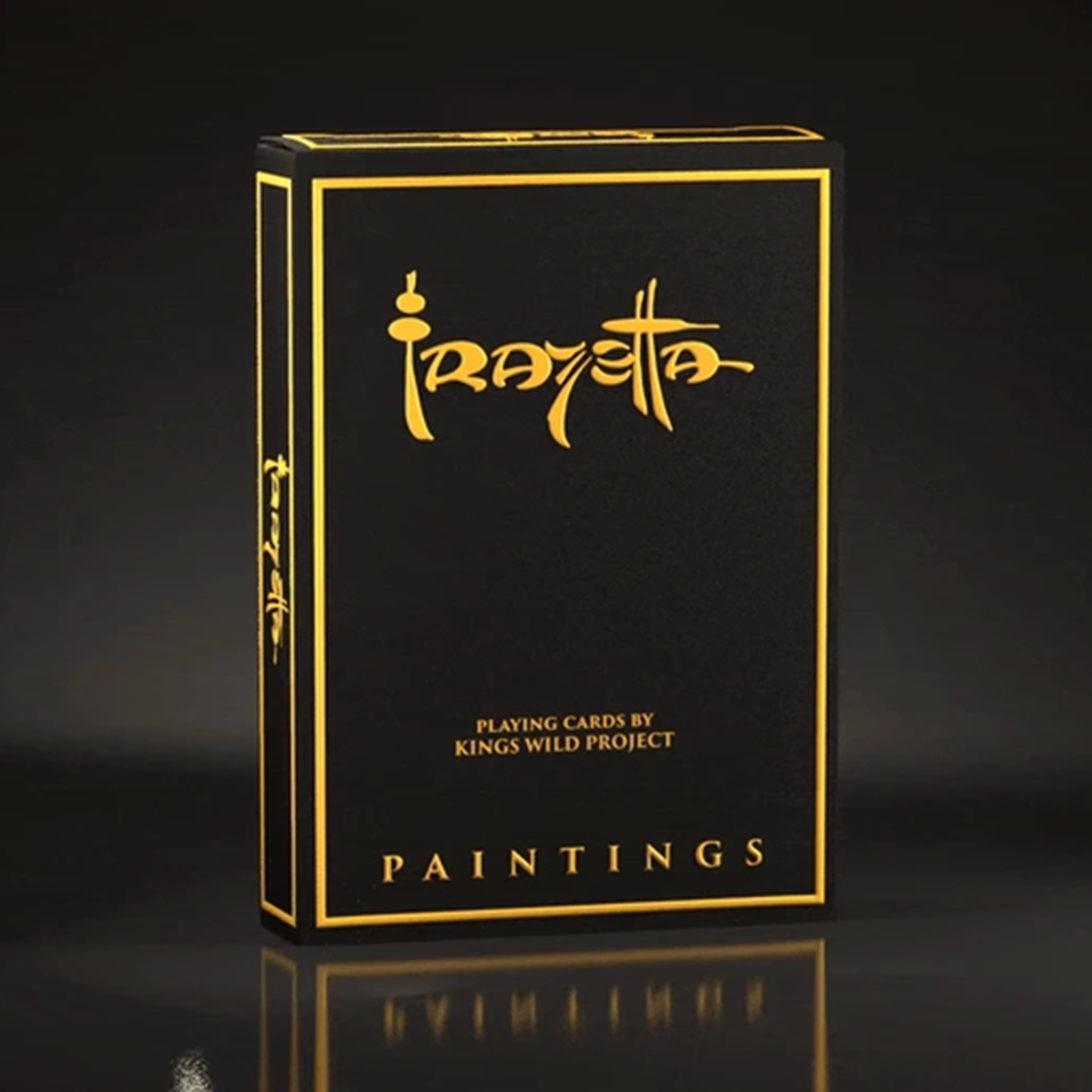 A high-end playing card deck from the Frazetta Drawings Edition is displayed against a sleek, dark background. The side of the box is adorned with the Frazetta signature, enhancing its luxury and collector’s appeal. The reflective gold details catch the light, emphasizing the deck’s premium craftsmanship.