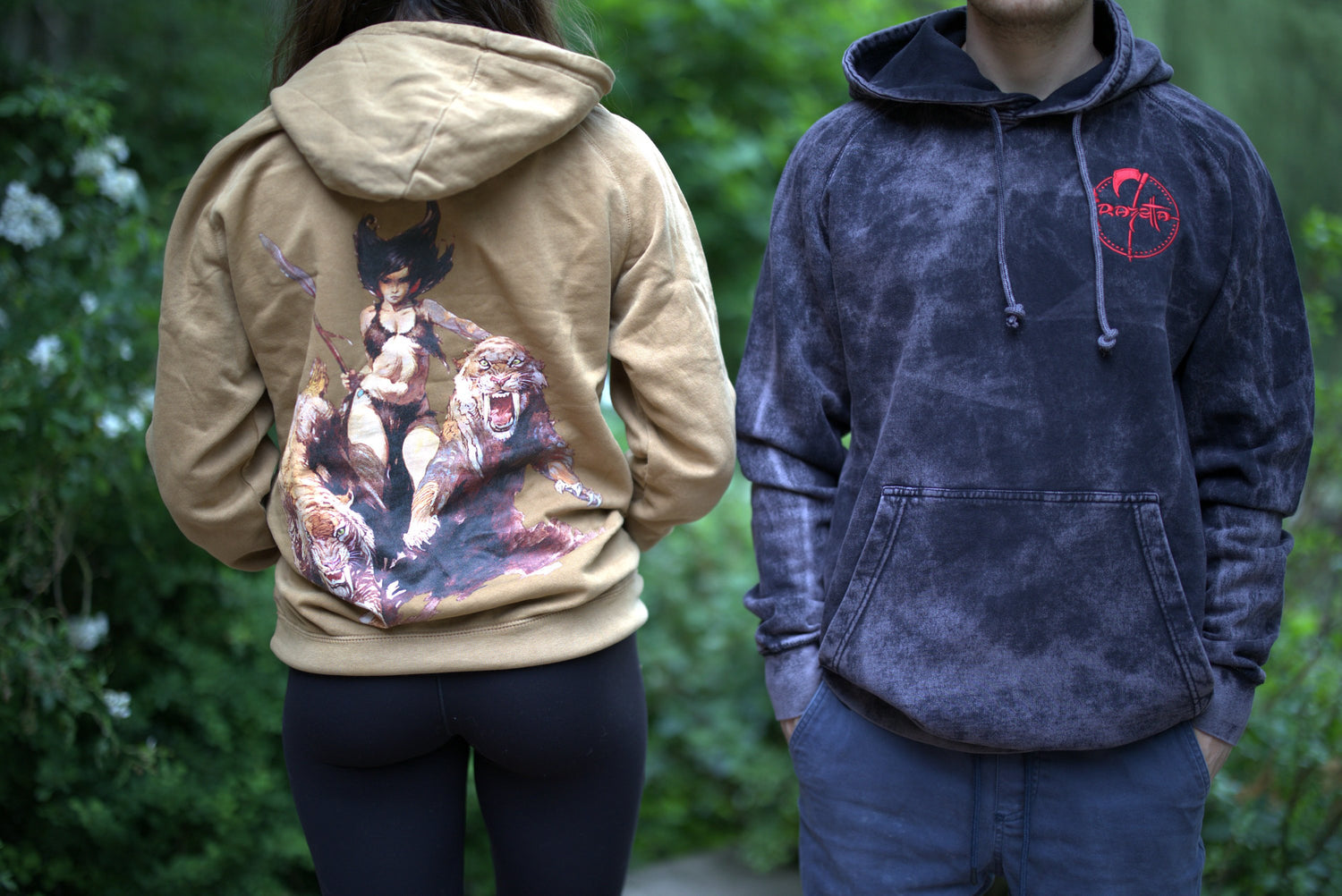 A man and a woman wearing Frazetta hoodies featuring Frazetta&