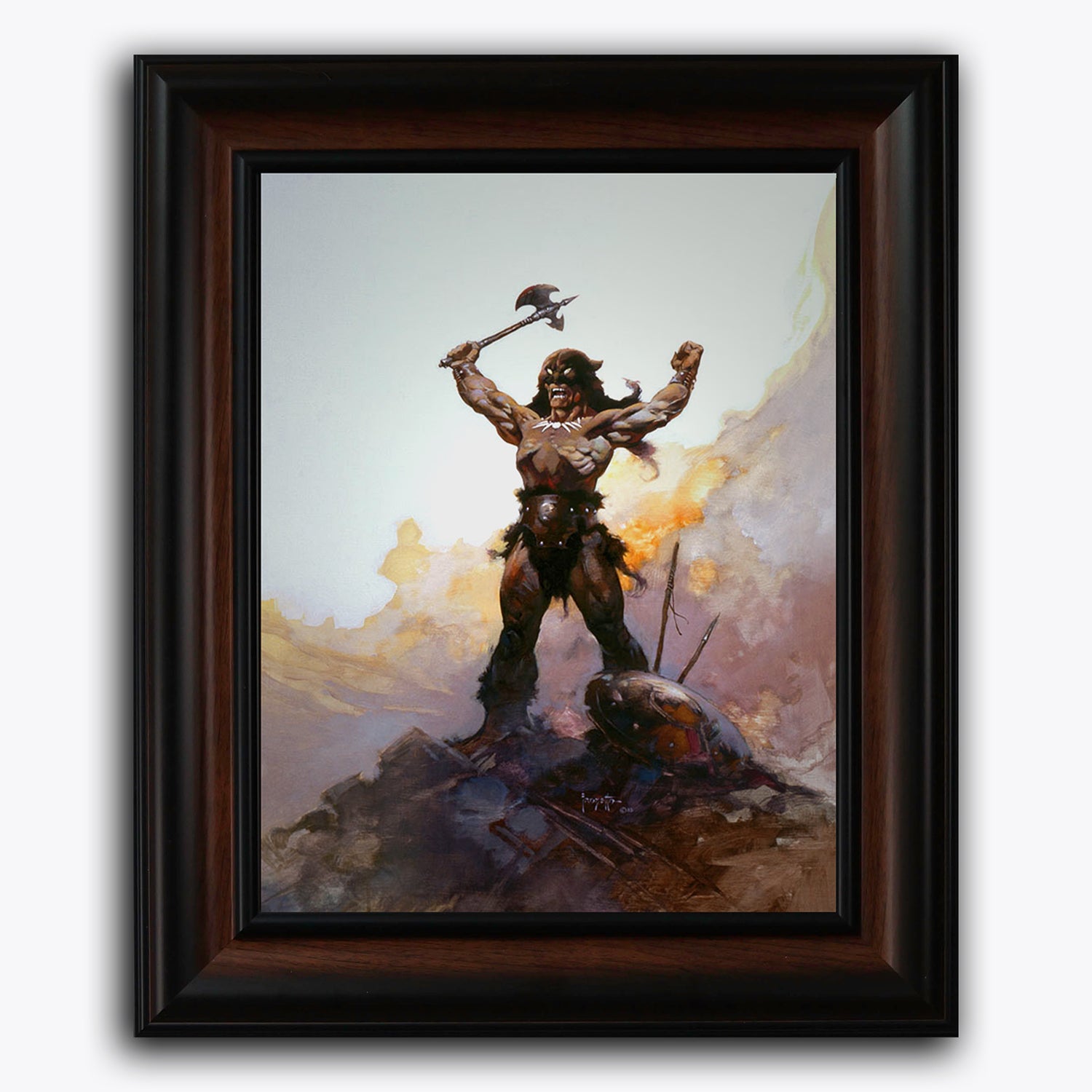 Framed fine art print of Frank Frazetta’s Days of Wrath, featuring a powerful barbarian warrior standing triumphantly on a rocky peak with arms raised and axe in hand. The backdrop blazes with fire and smoke, suggesting a victorious battle scene.