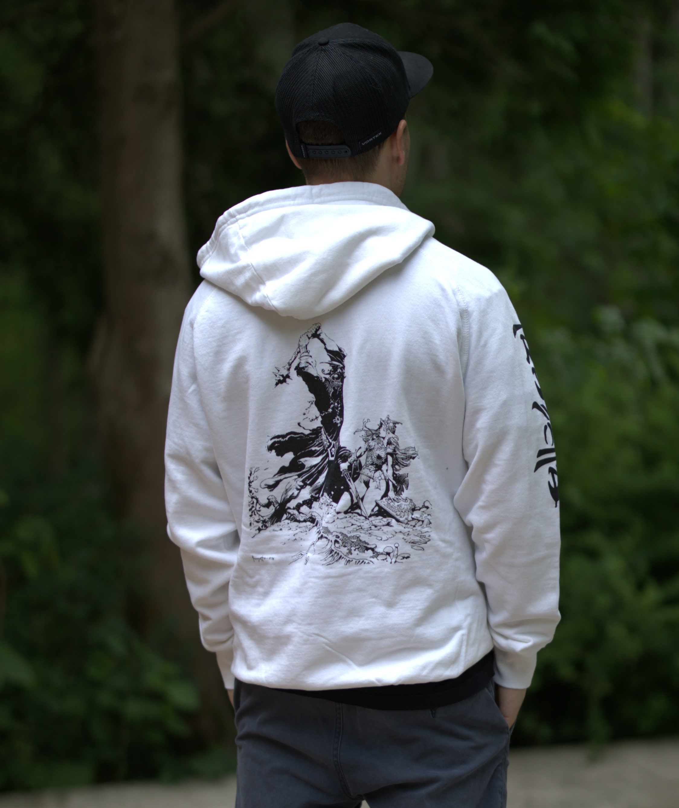 Photo of a Man wearing the Witch King hoodie – The hoodie features Frazetta's Witch King drawing in black on the back of a white Premium Cotton hoodie.